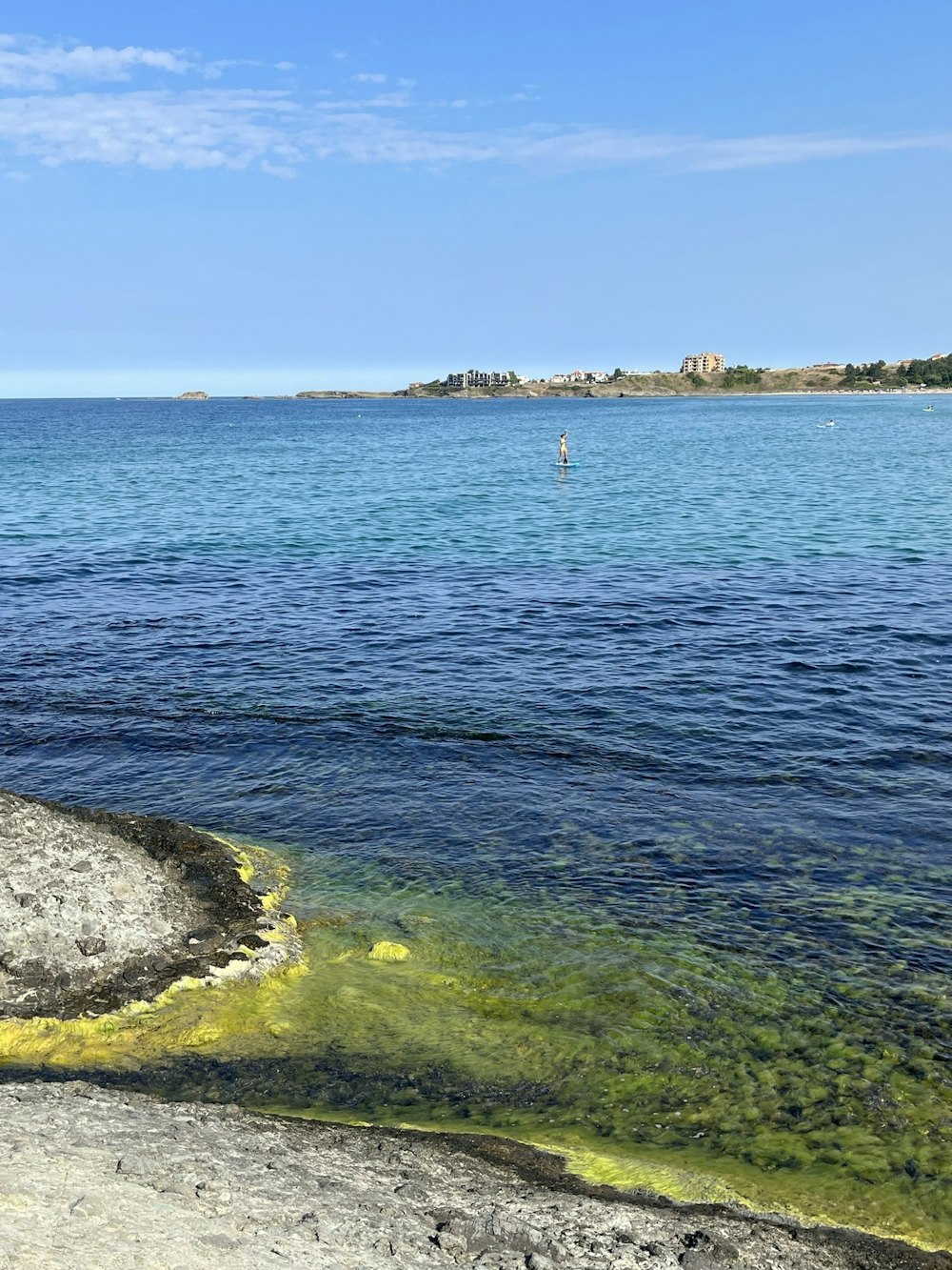 a body of water with a boat in the distance