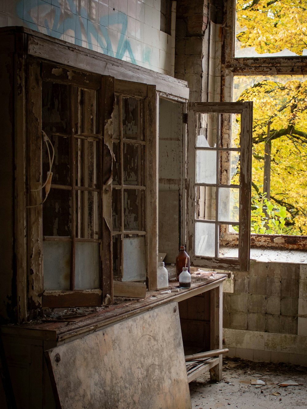 an old run down building with a broken window