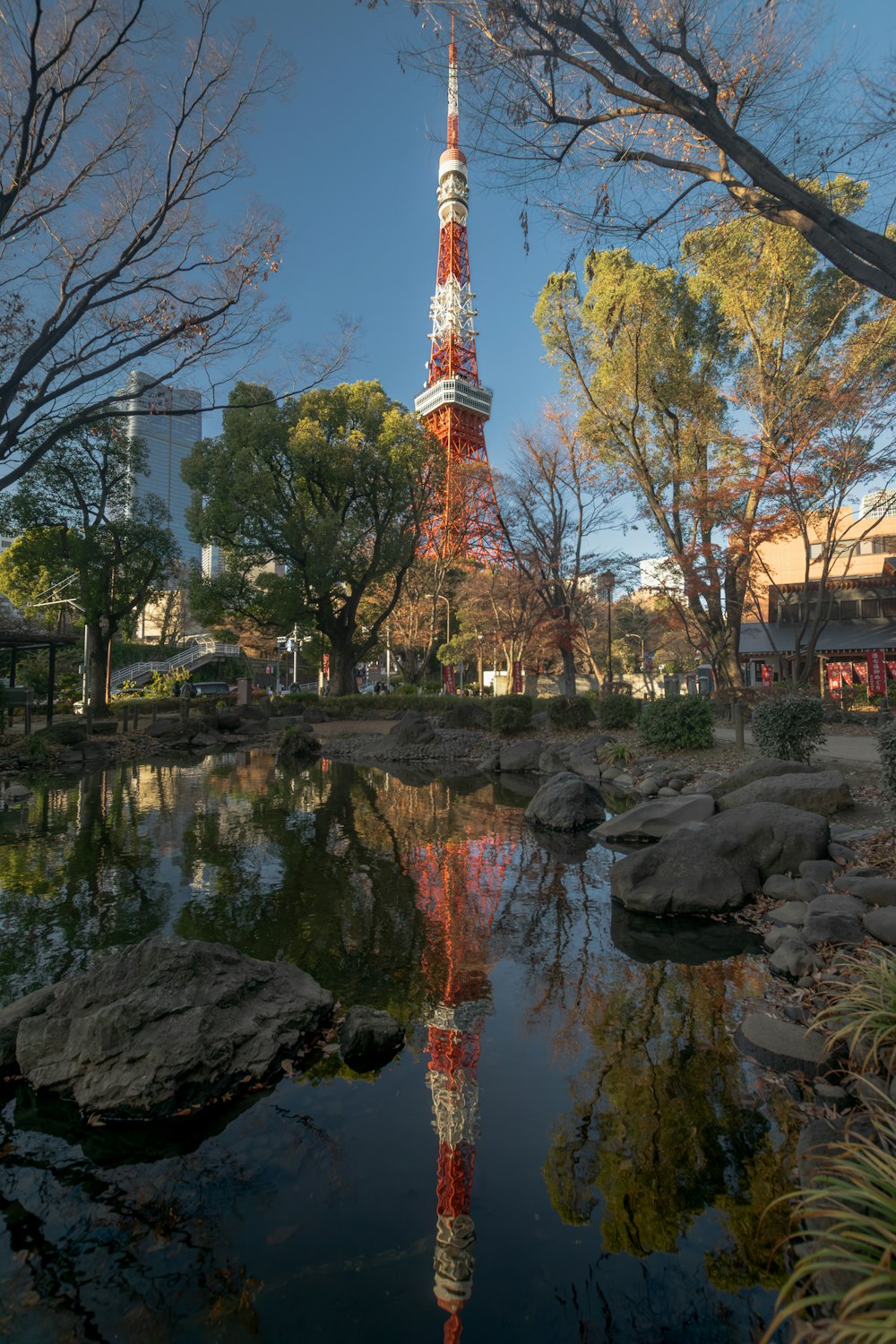 a reflection of the eiffel tower in a pond