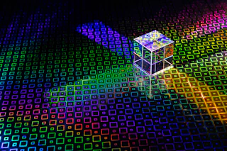 a colorful cube with a bright light coming out of it