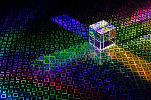 a colorful cube with a bright light coming out of it