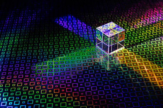 a colorful cube with a bright light coming out of it