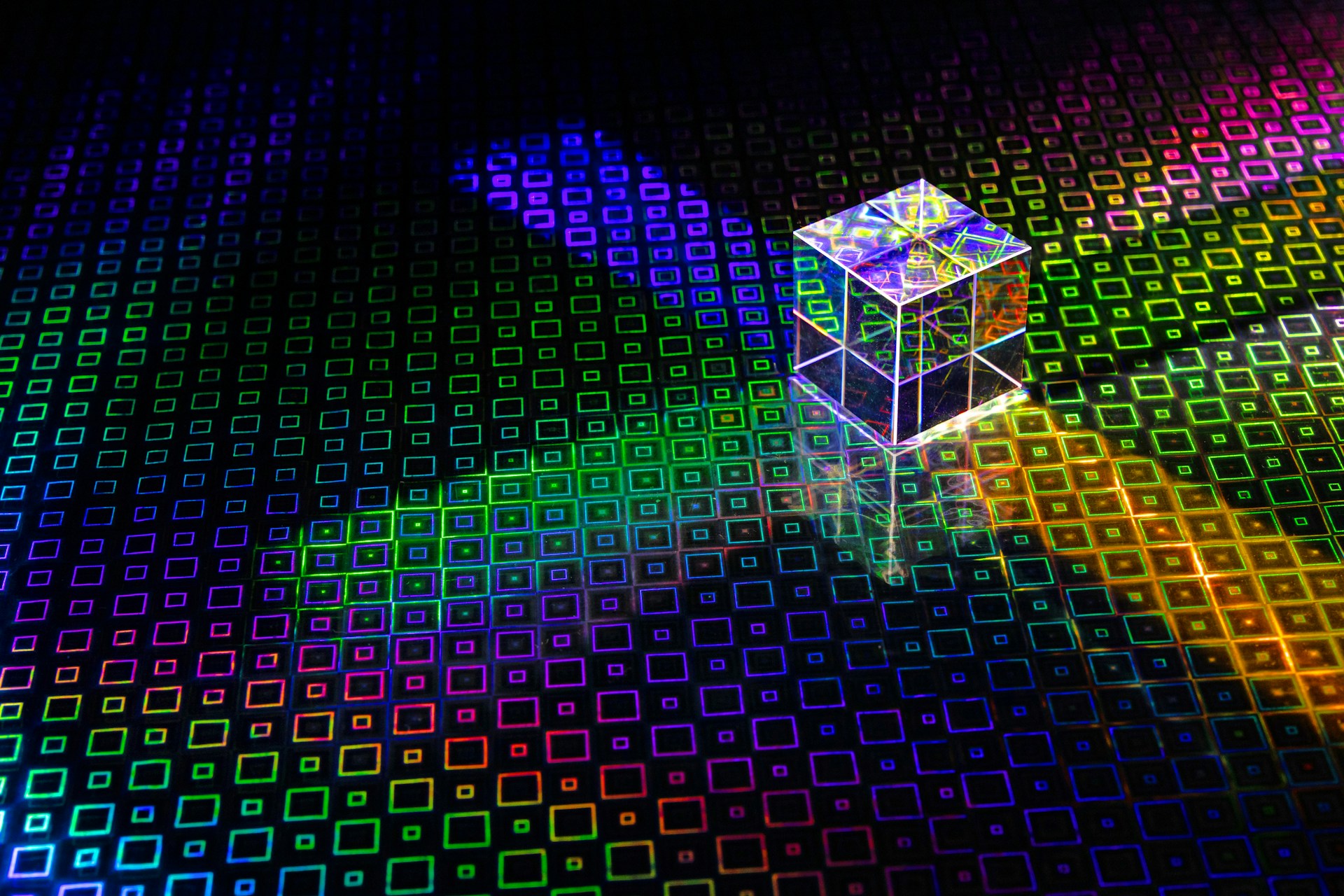 a colorful cube with a bright light coming out of it