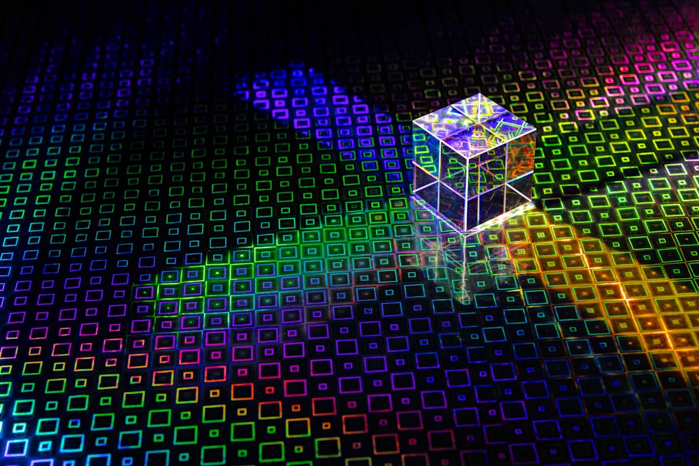 a colorful cube with a bright light coming out of it