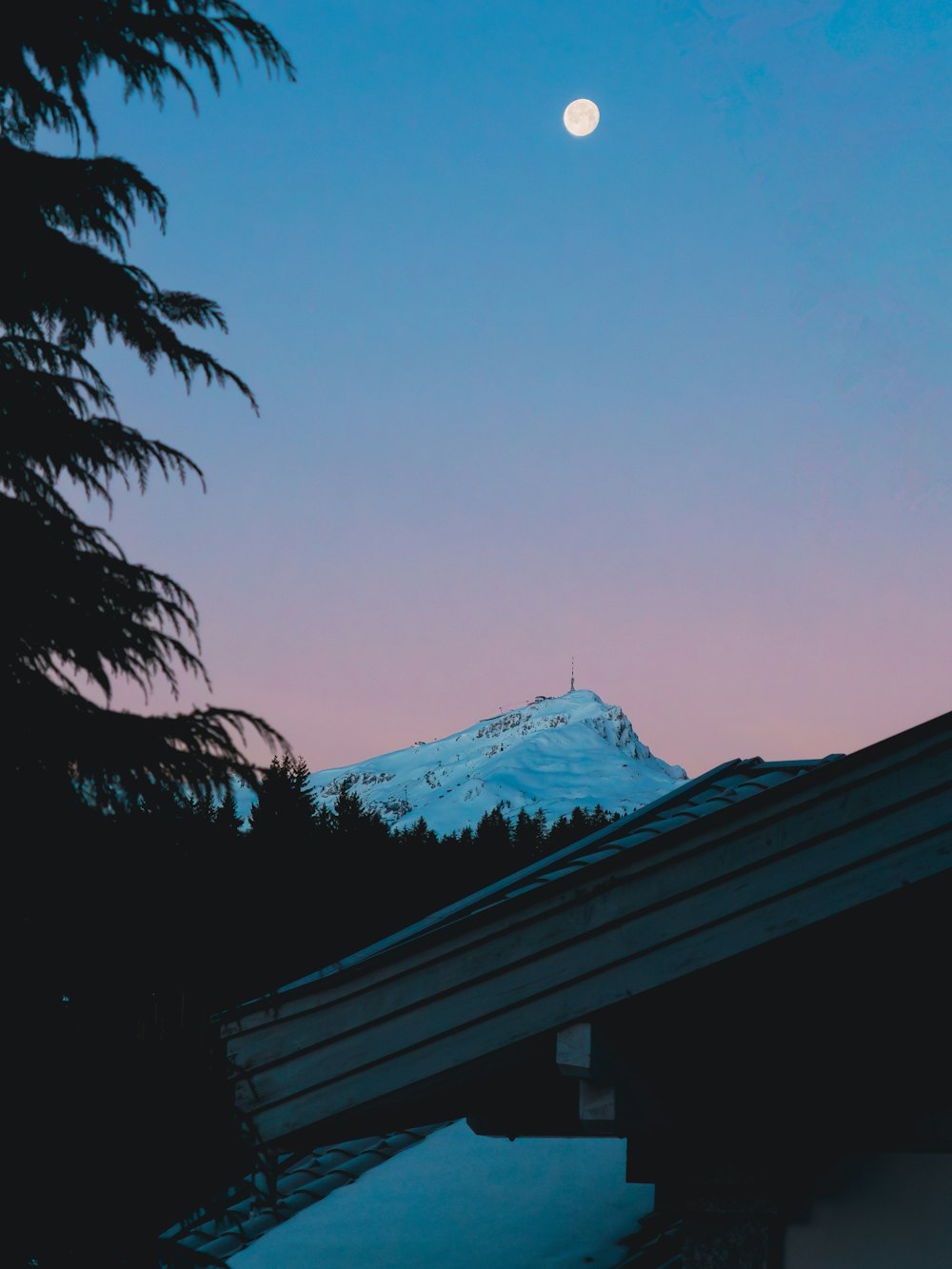 a view of a snow covered mountain in the distance