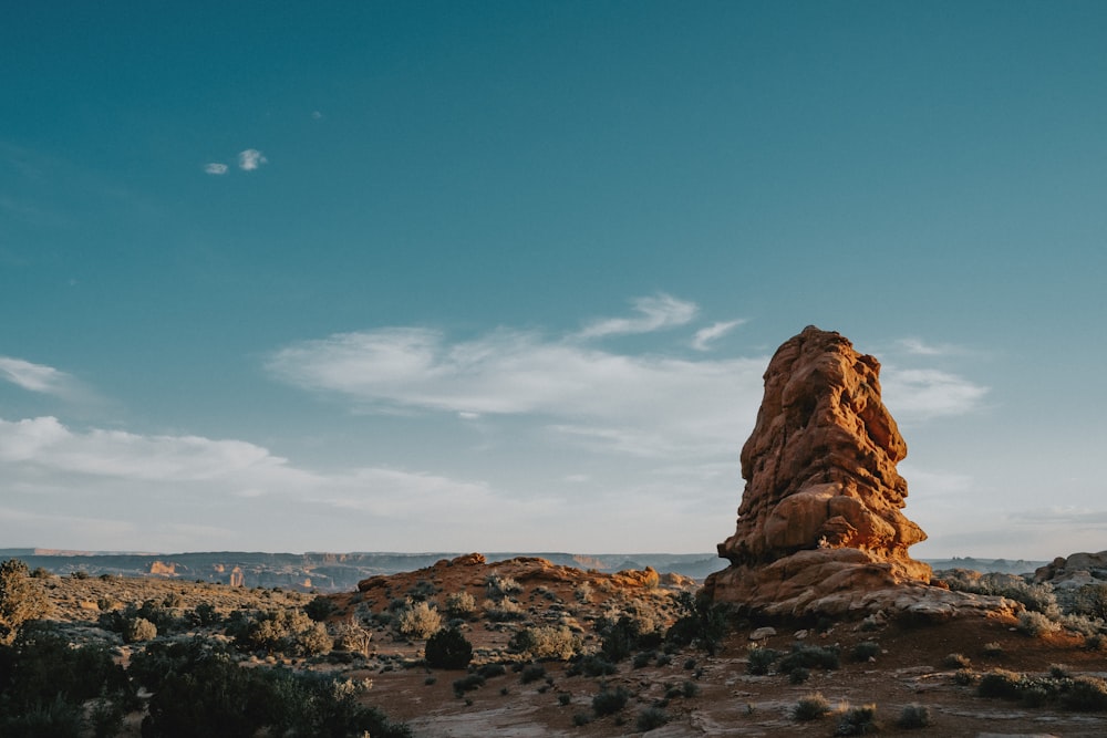 a rock formation in the middle of a desert