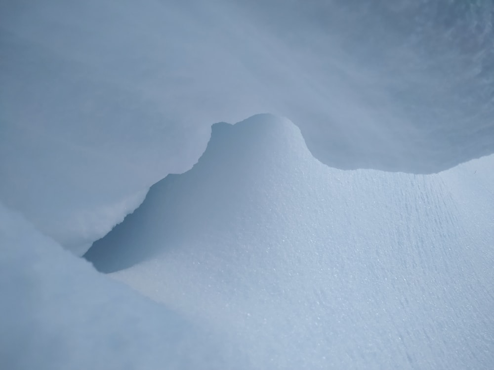 a person skiing down a snow covered slope