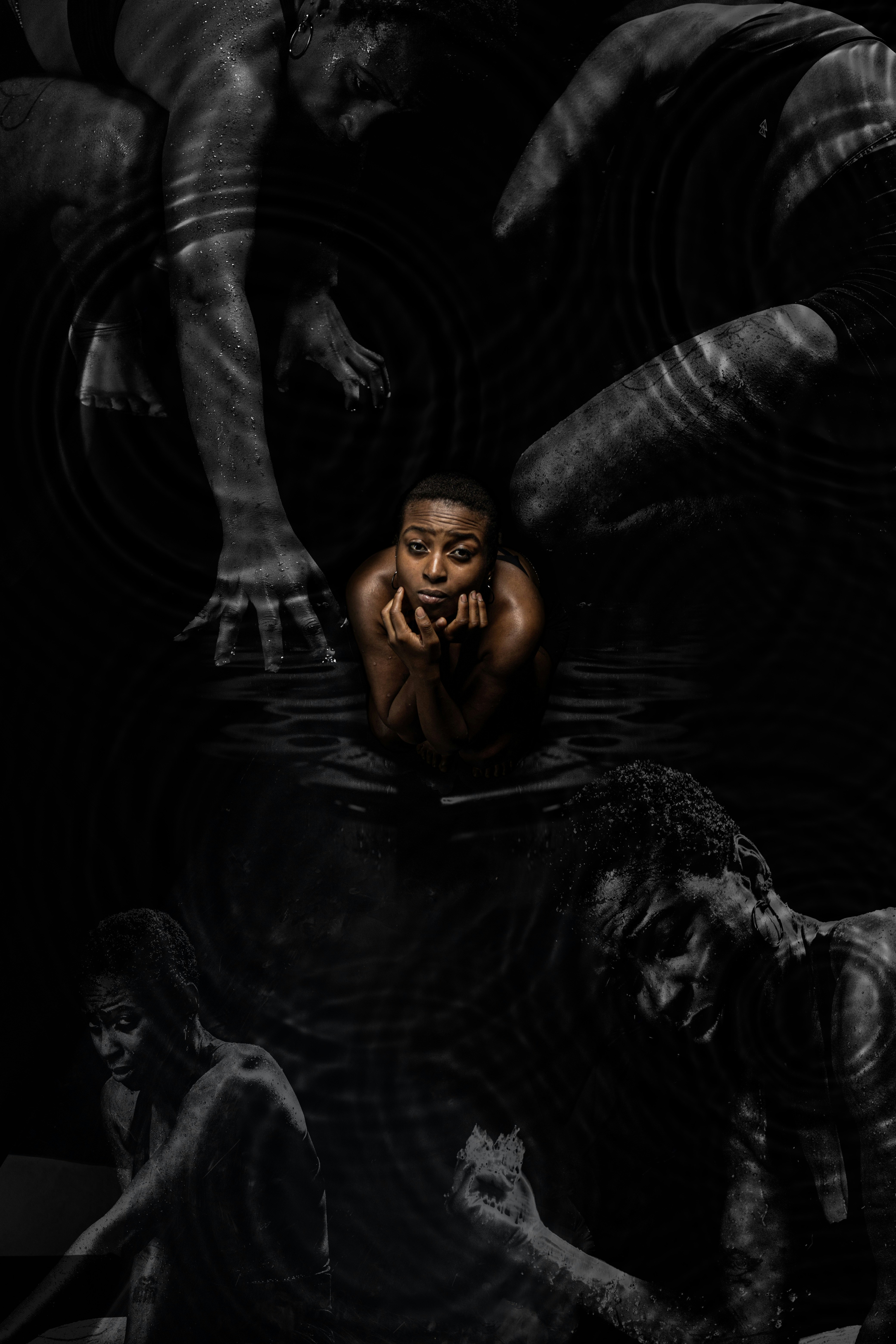 a man is floating in the water with his hands on his face