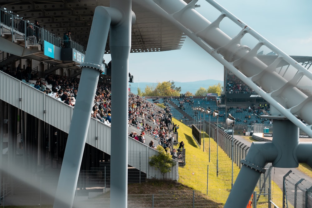 a stadium full of people watching a race