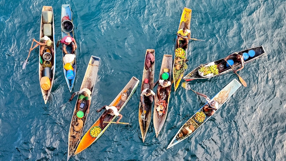 a group of boats floating on top of a body of water