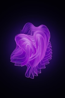 a purple liquid swirl on a black background