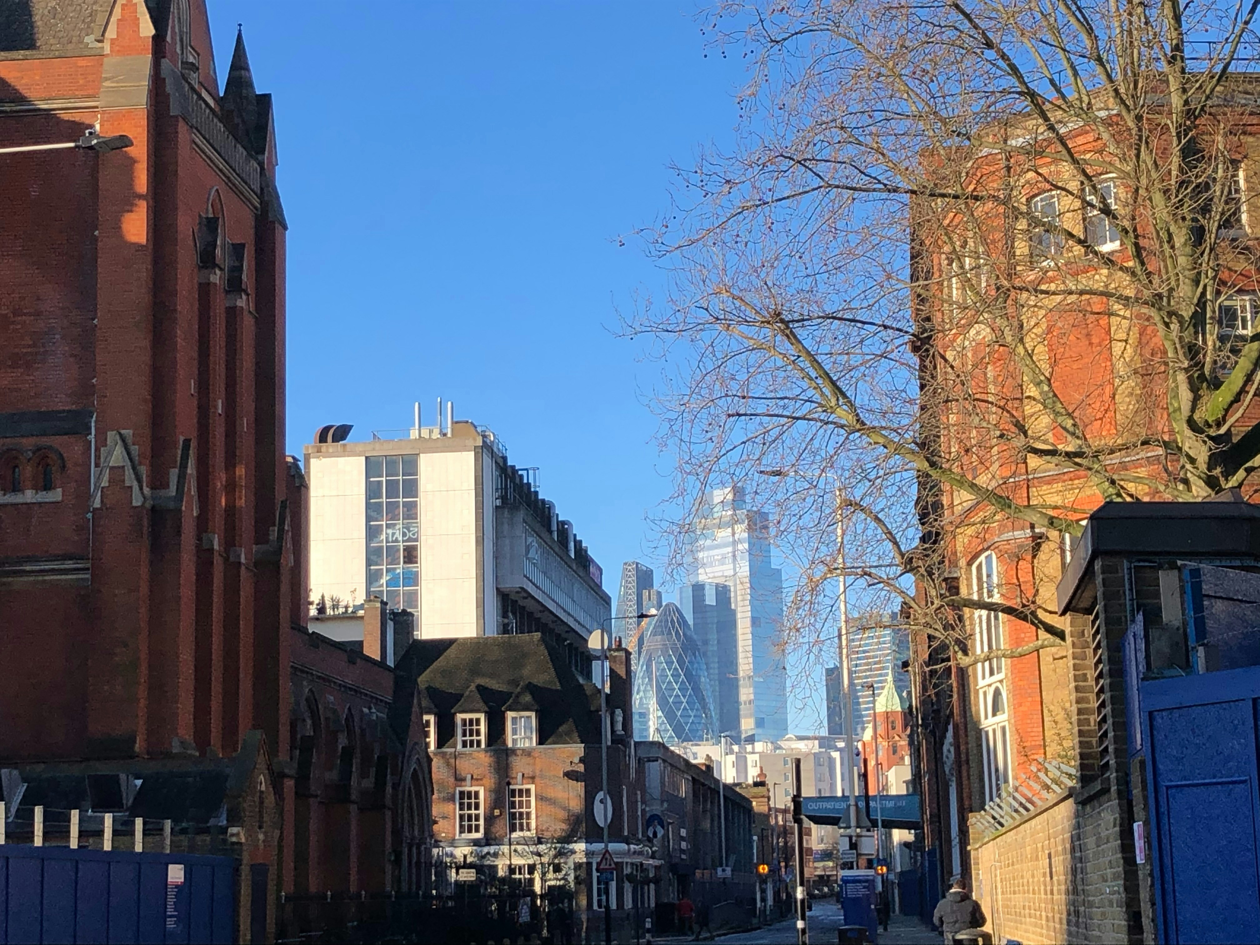 a city street with tall buildings in the background, Taken in London