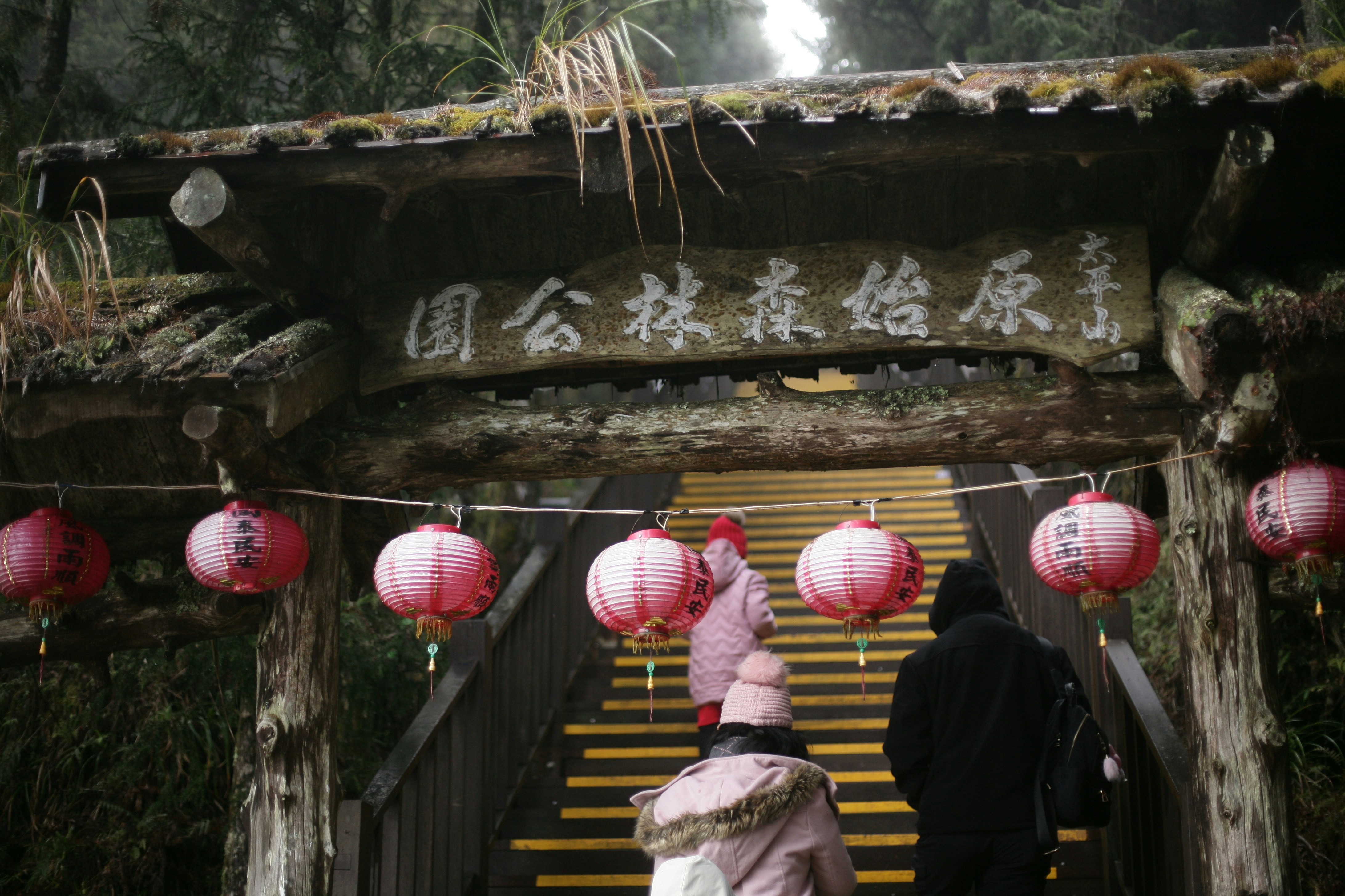 a couple of people walking down a set of stairs