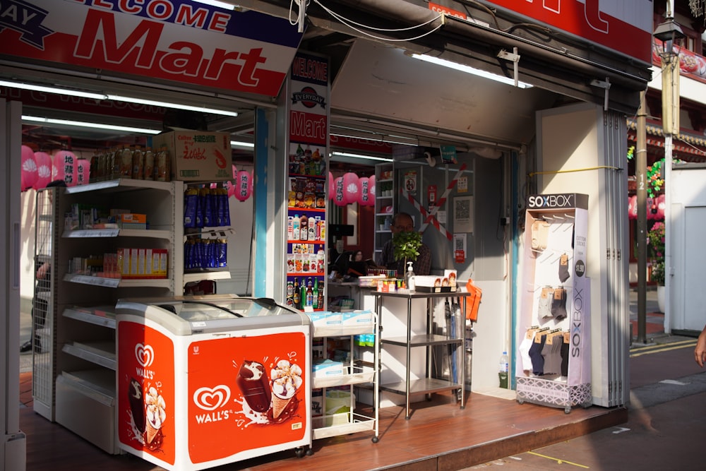 a woman walking past a small store front