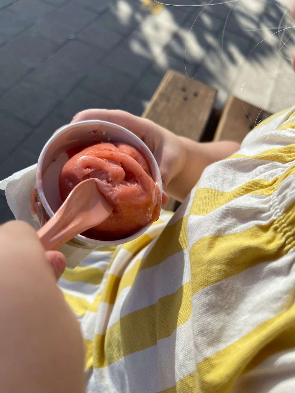 a person is holding a bowl of food