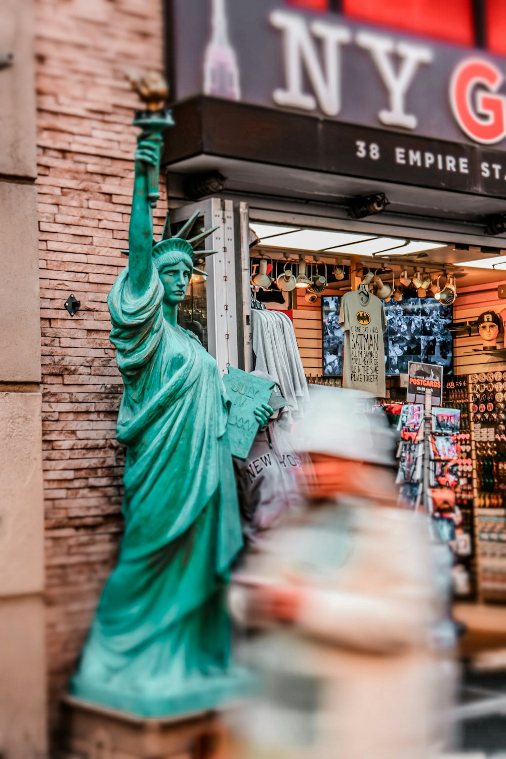 a statue of liberty in front of a store