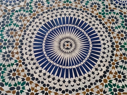 a blue and white tile with a circular design