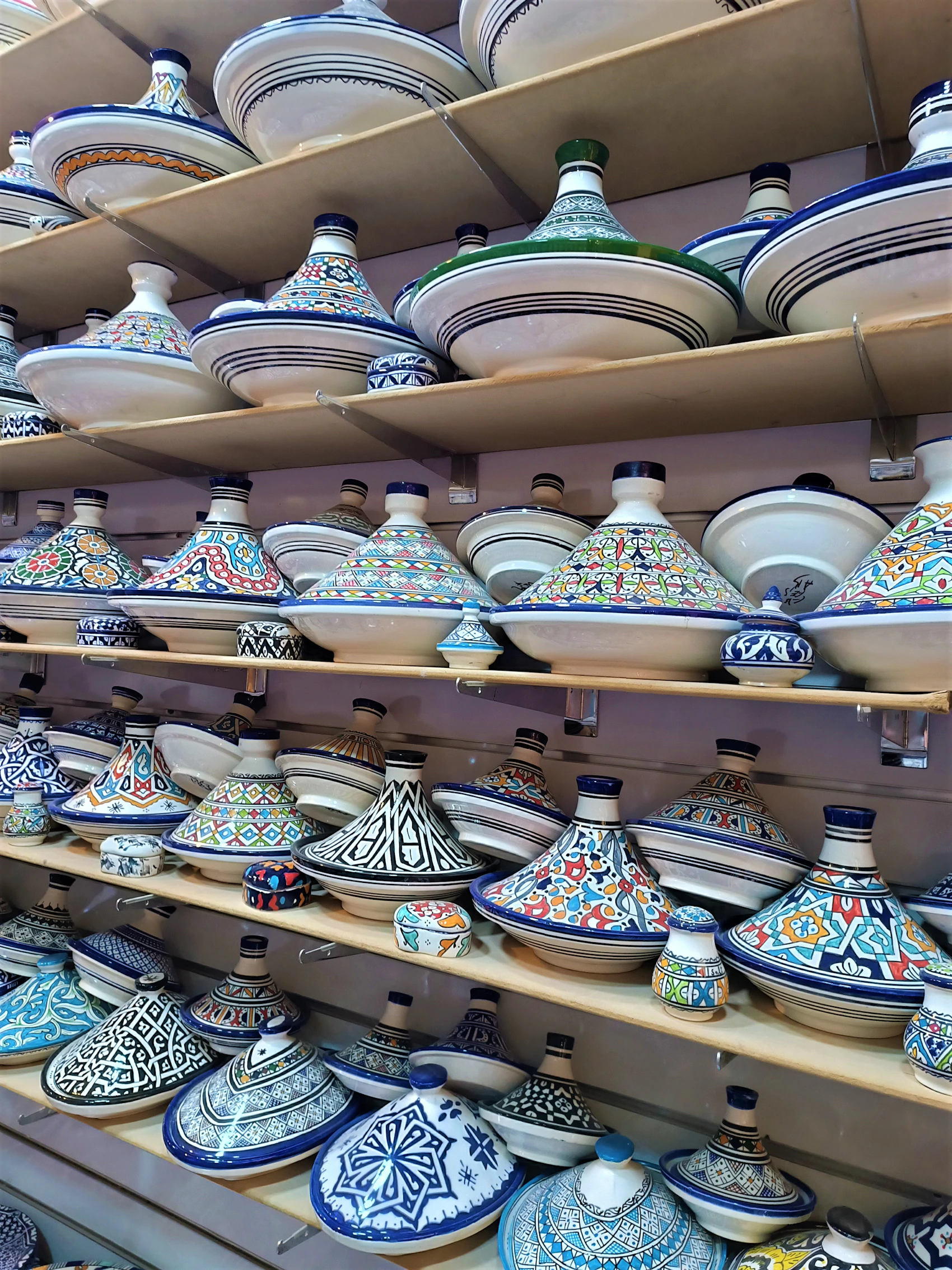 Blue-and-white Fassi ceramics displayed together in a workshop