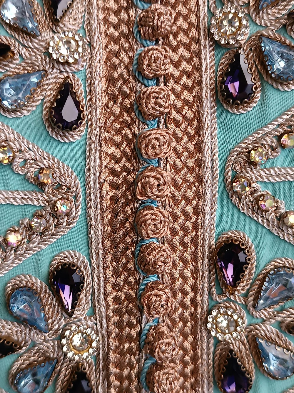 a close up of a piece of clothing with beads