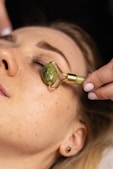 a woman getting a facial peel from a woman's face