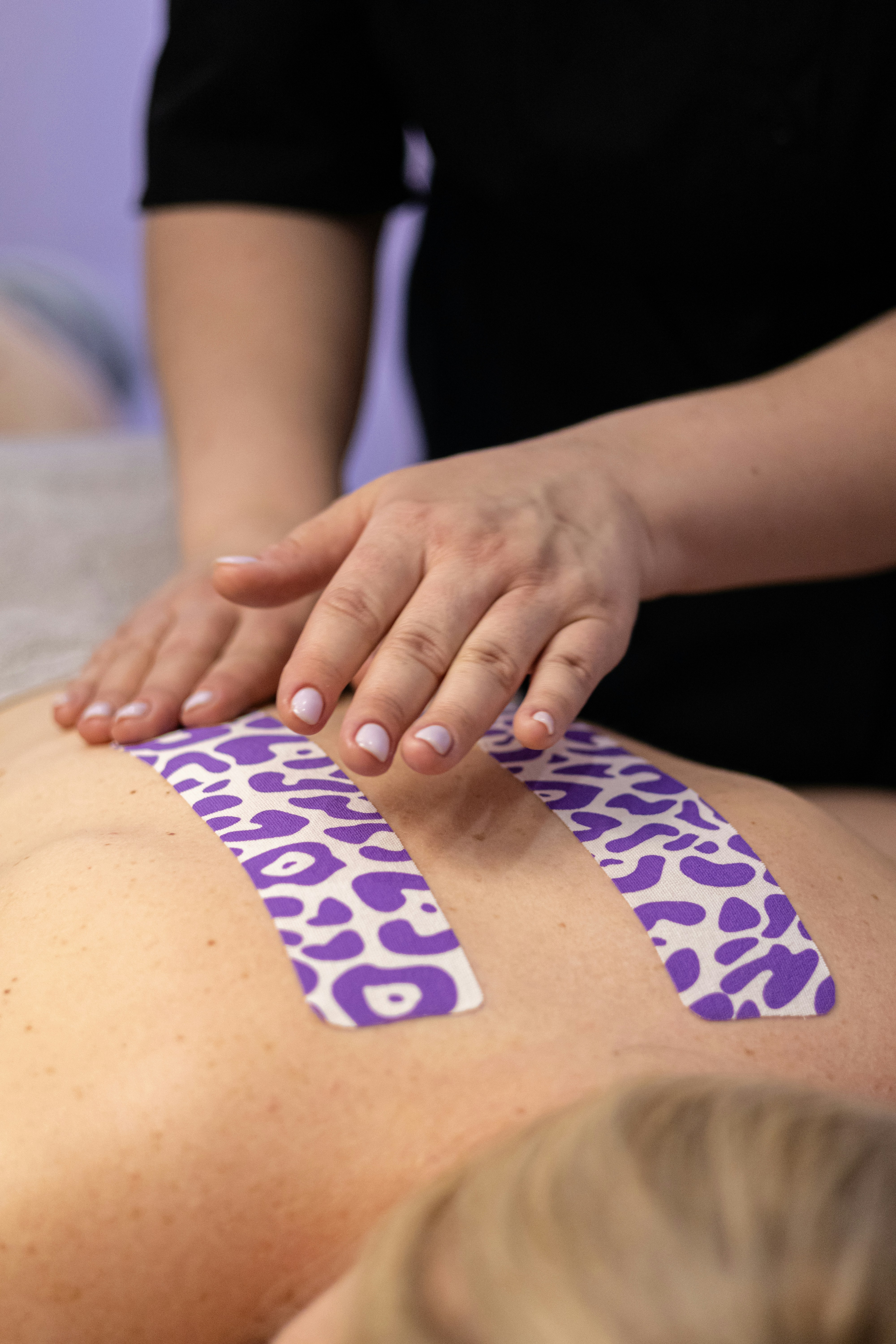 Person practicing lymphatic massage techniques