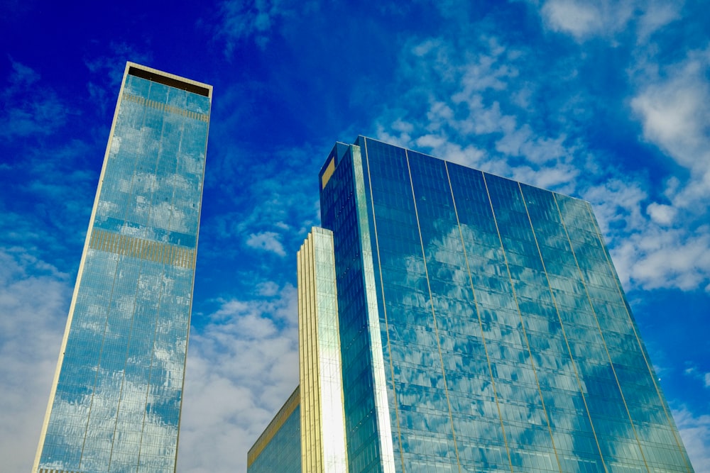 a couple of tall buildings sitting next to each other