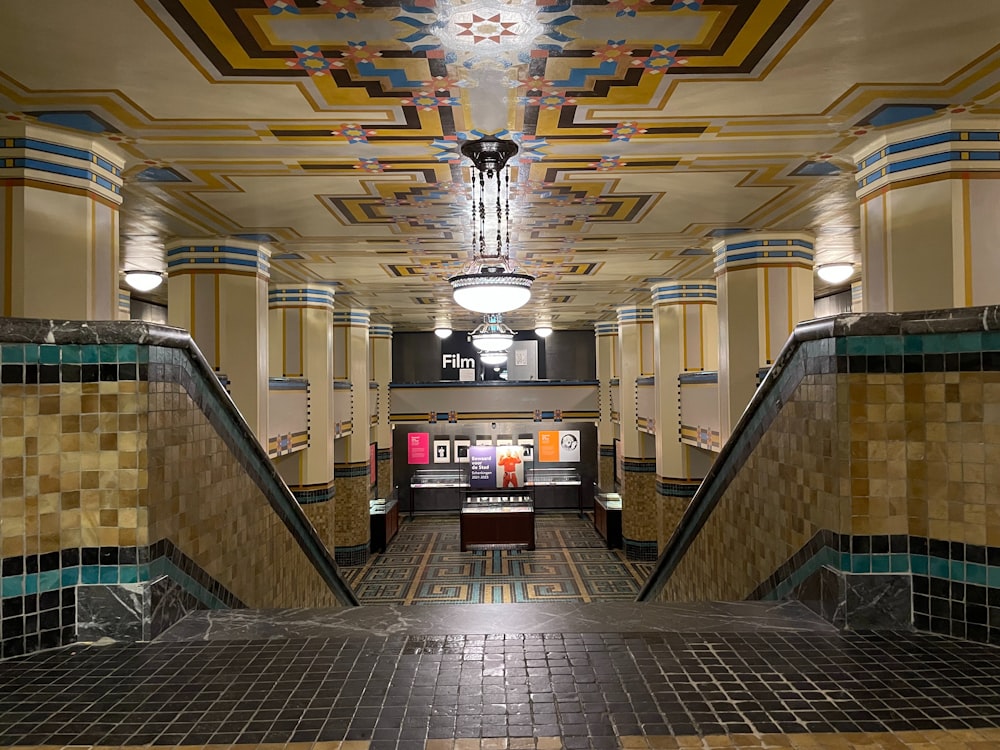 a very long hallway with a bunch of tiles on the floor