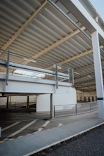 an empty parking garage with a metal roof