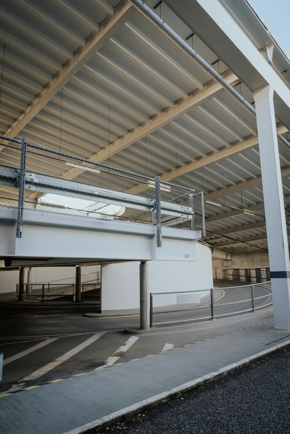 an empty parking garage with a metal roof