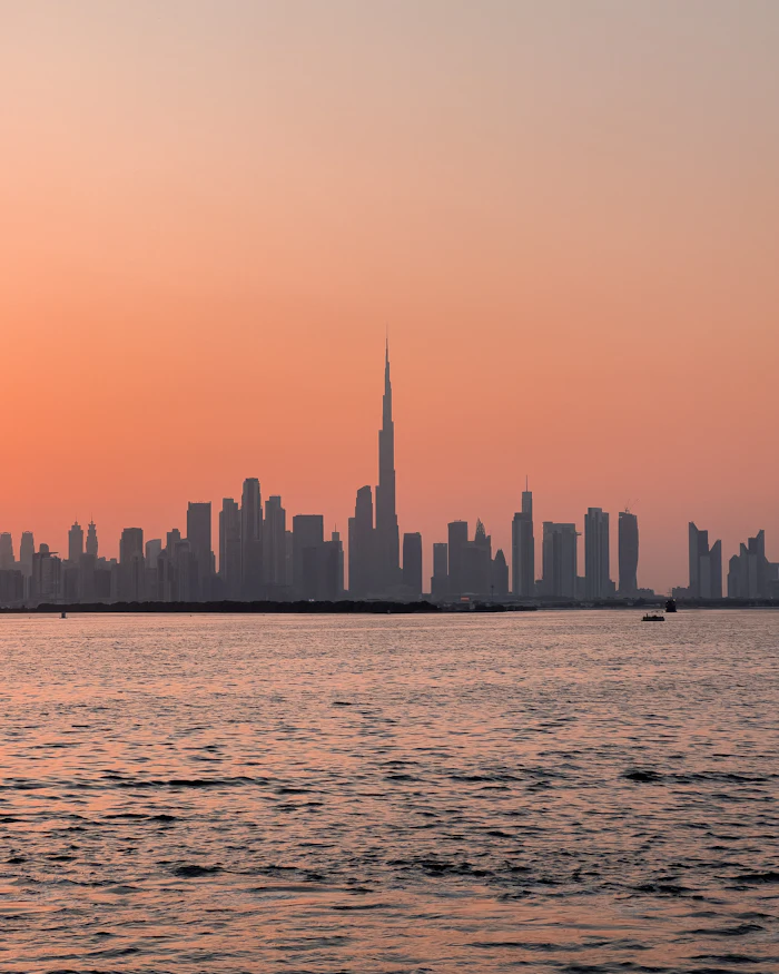 City towers beyond a wide stretch of water