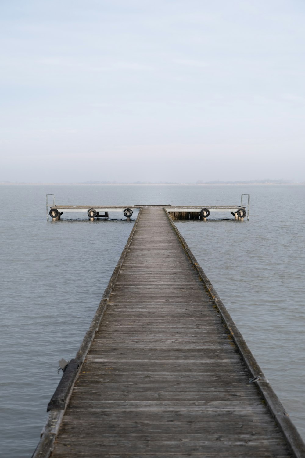 a long pier extending out into the ocean