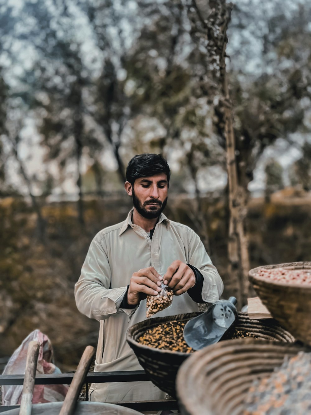 a man in a white shirt and a bowl of food