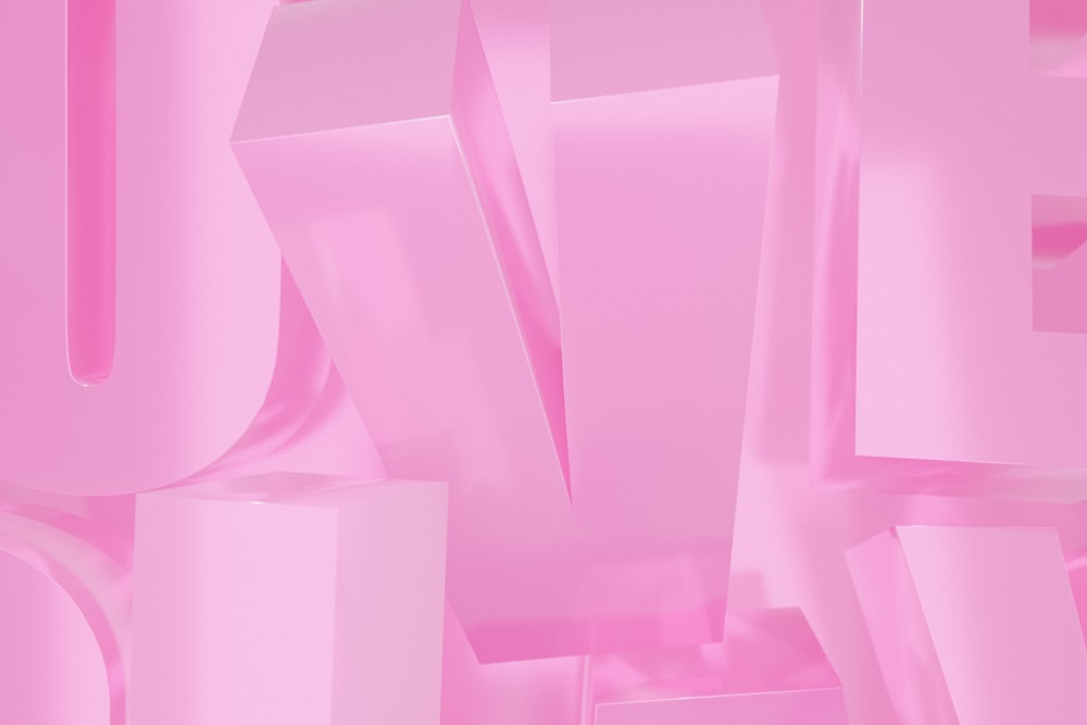 a close up of a pink background with letters