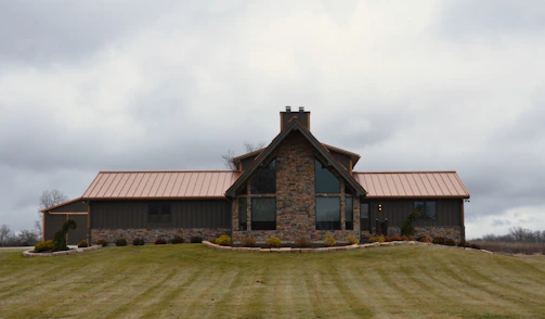 a house with a metal roof on a cloudy day