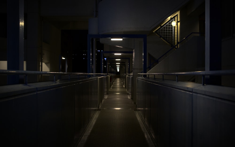 a dimly lit hallway leading to a building