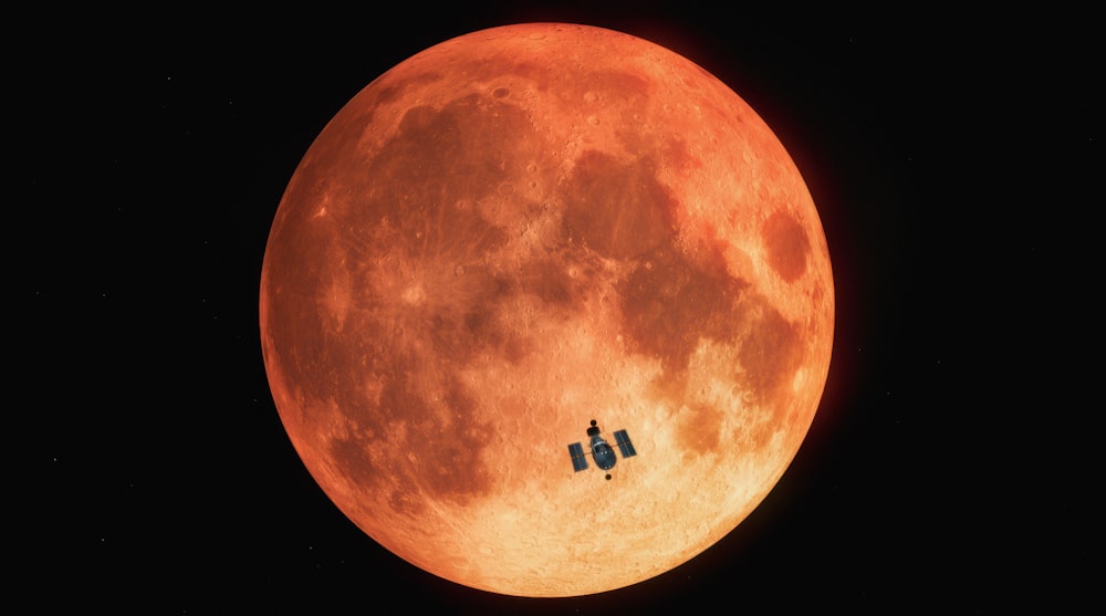 a couple of small airplanes flying in front of a large orange moon