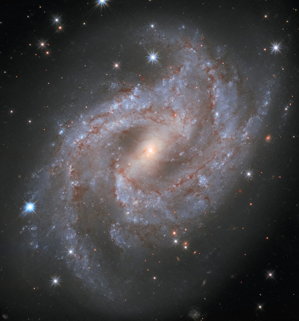 a spiral galaxy with stars in the background