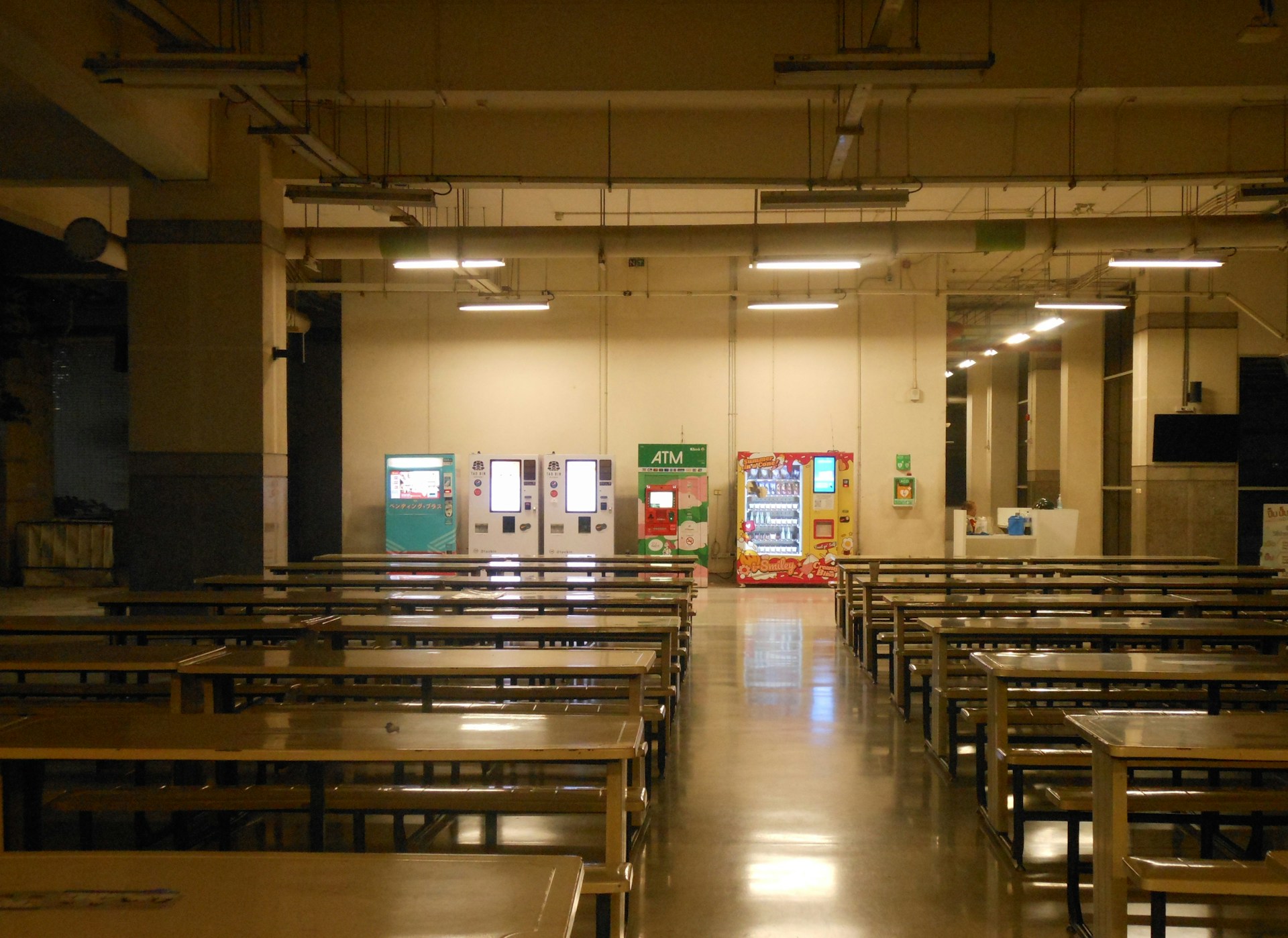 a room filled with wooden tables and chairs