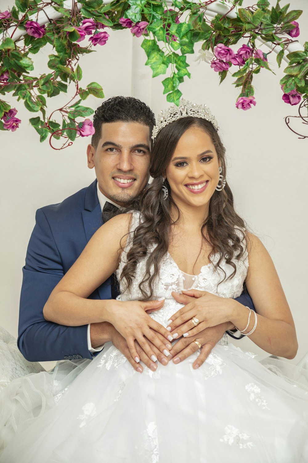 a bride and groom posing for a picture