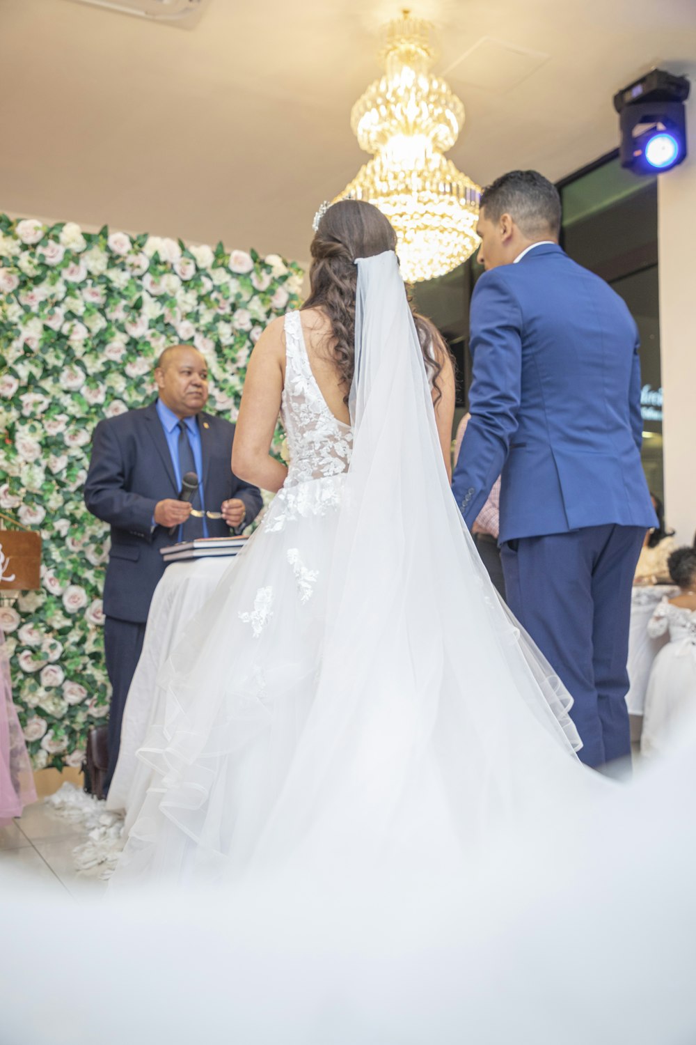 a bride and groom standing at the alter of a wedding ceremony