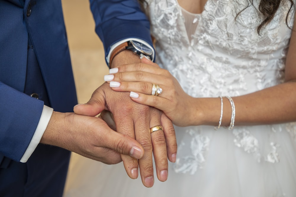 a close up of a person holding another person's hand