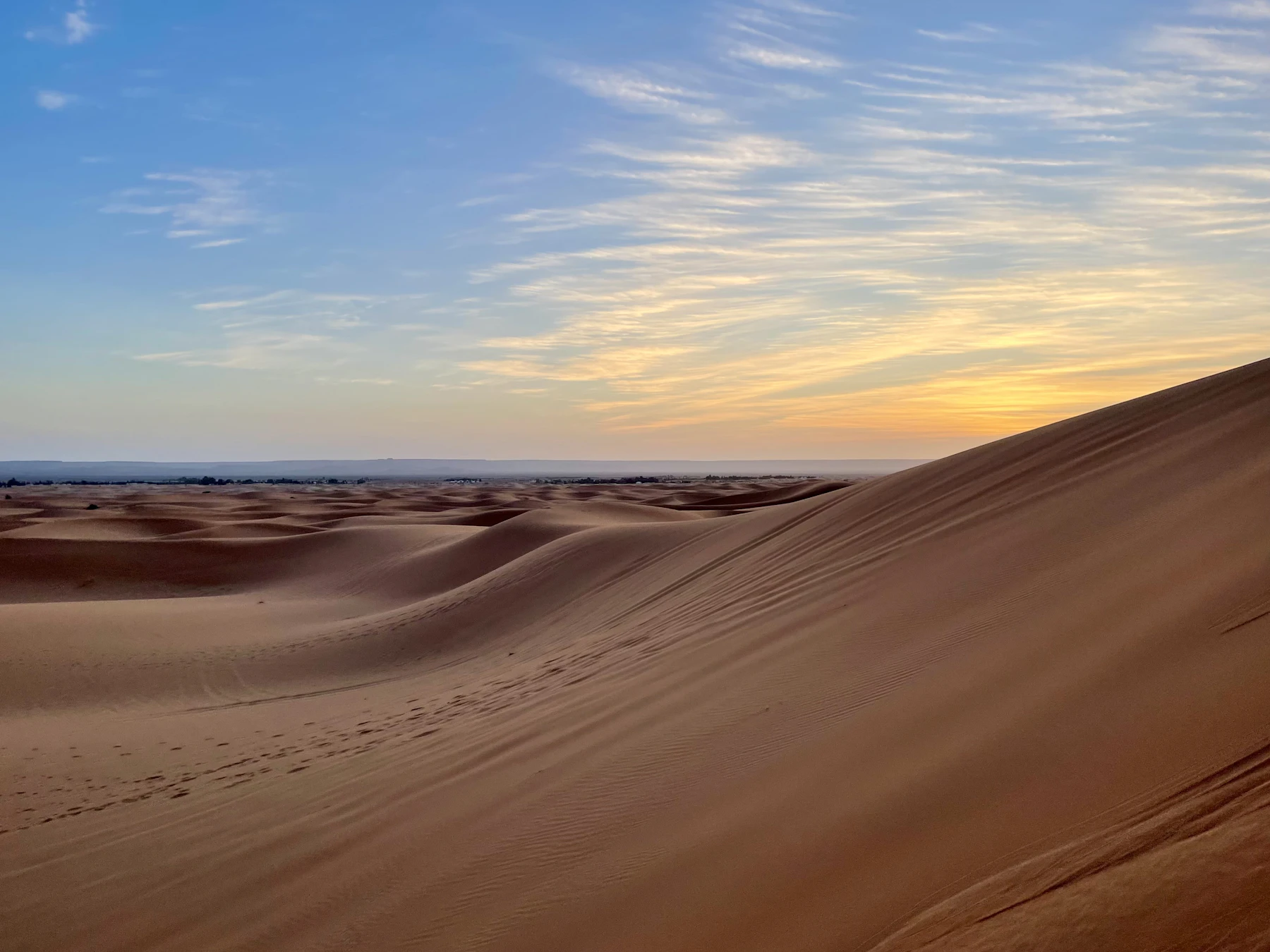 Sunrise light over the rolling Sahara dunes near Merzouga
