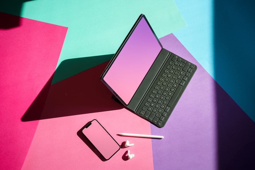 a laptop computer sitting on top of a table