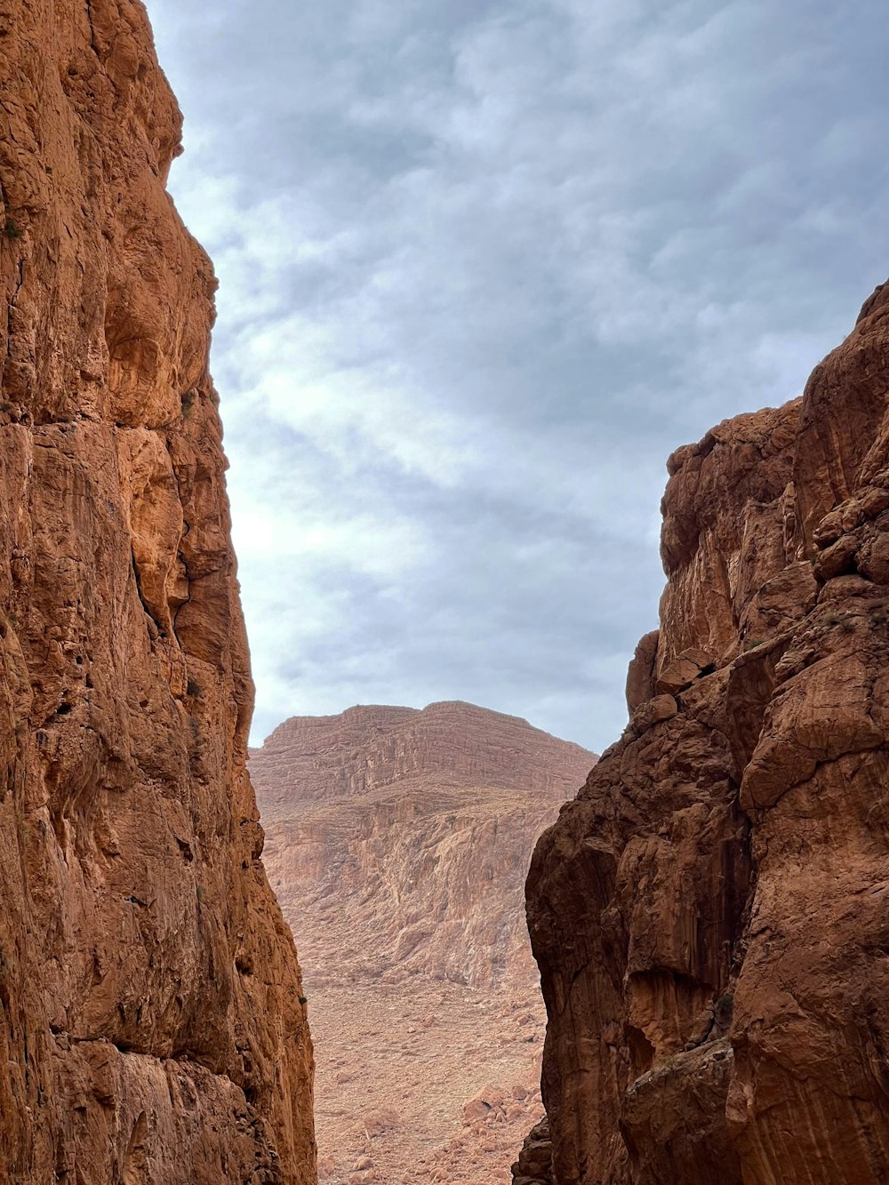 a man riding a horse through a canyon