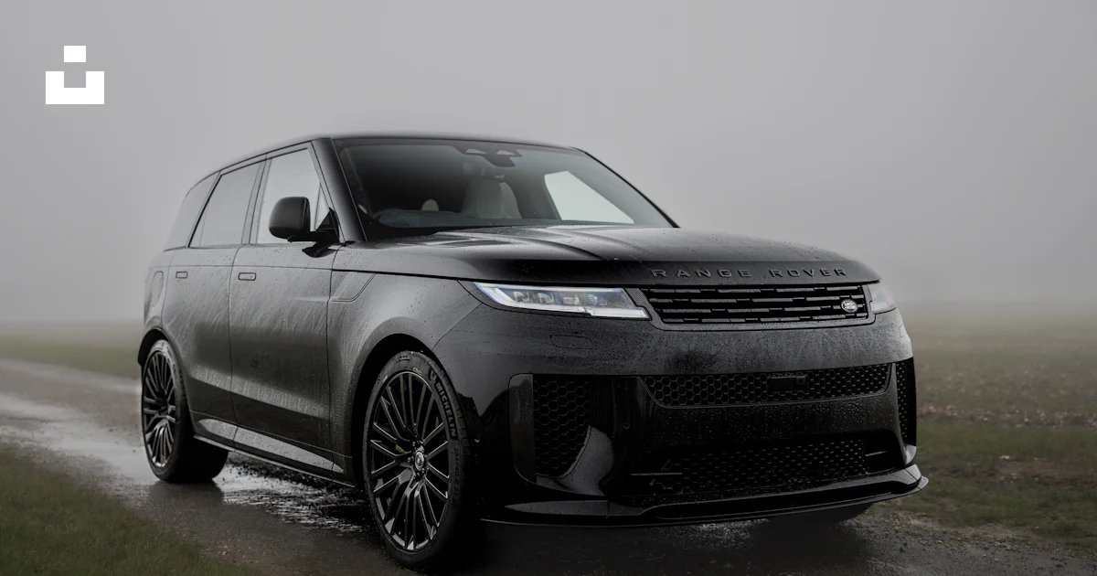 Range Rover Low Riding A black range rover driving on a wet road photo – Free Automobile Image ...