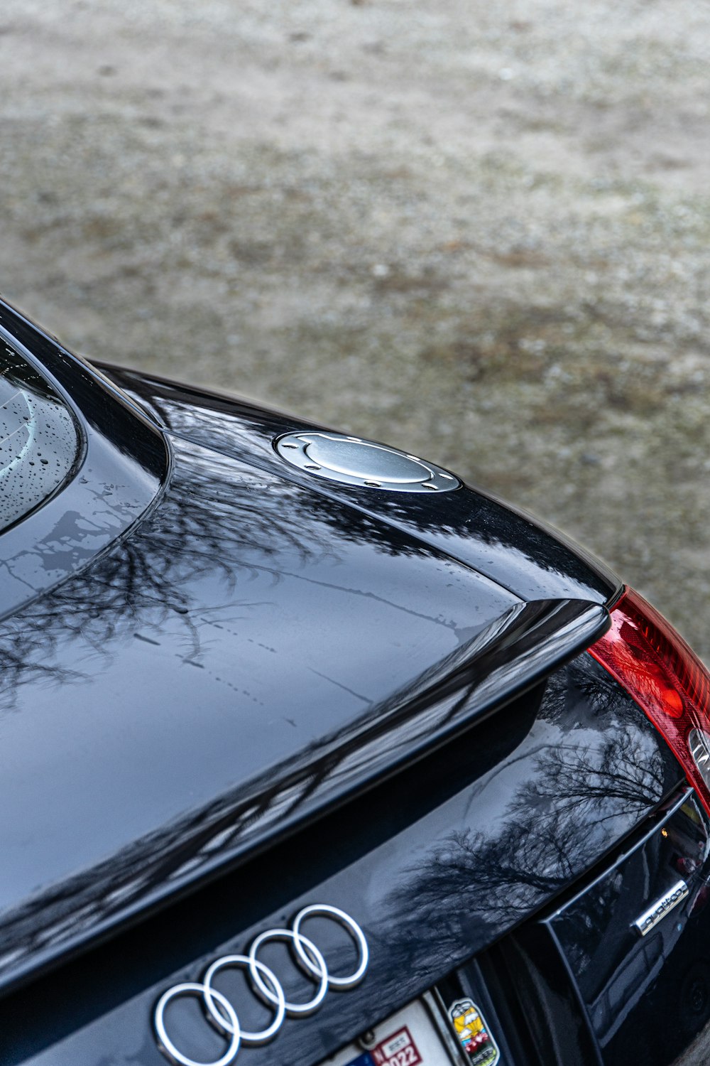 a close up of the rear end of a black car