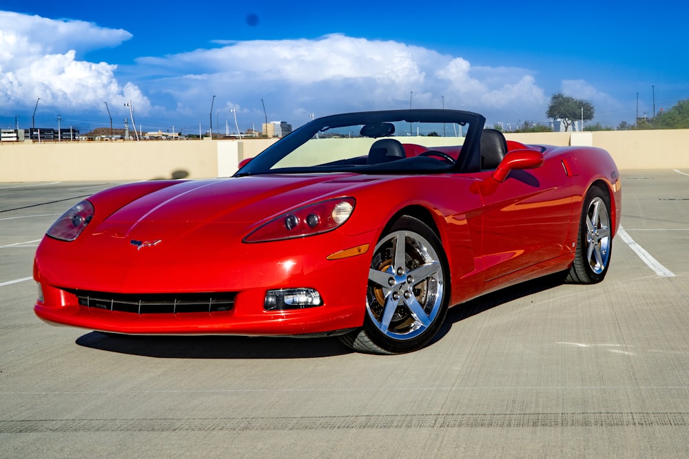 a red sports car parked in a parking lot