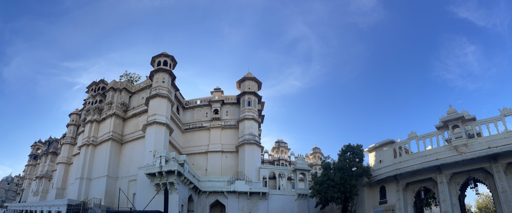 a large white building with a clock tower