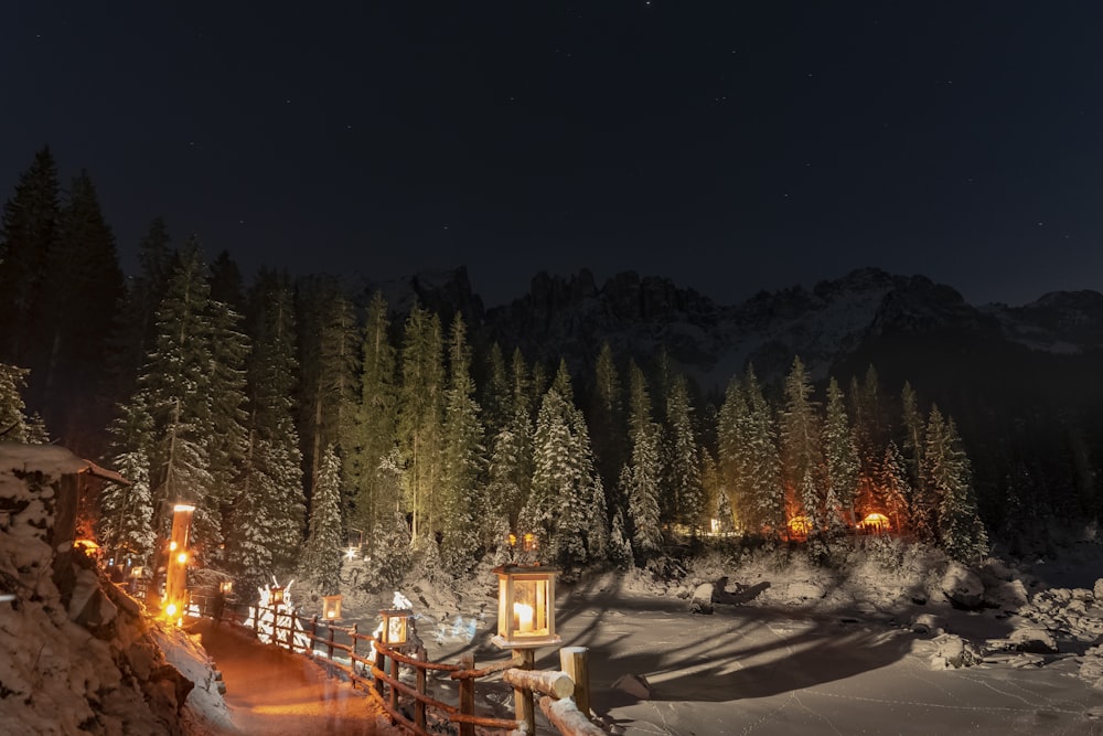 a night time view of a snow covered mountain