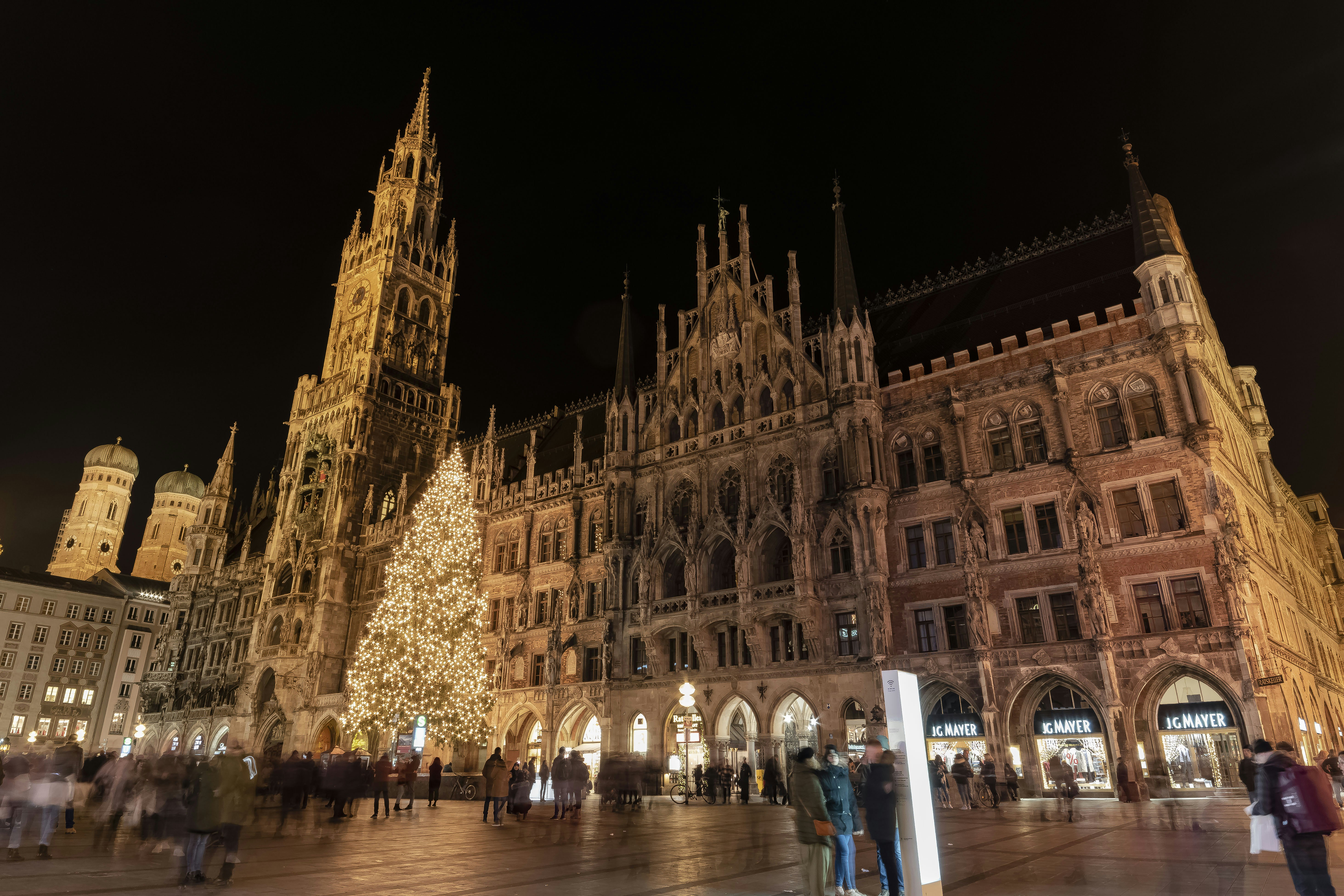 a group of people standing in front of a building